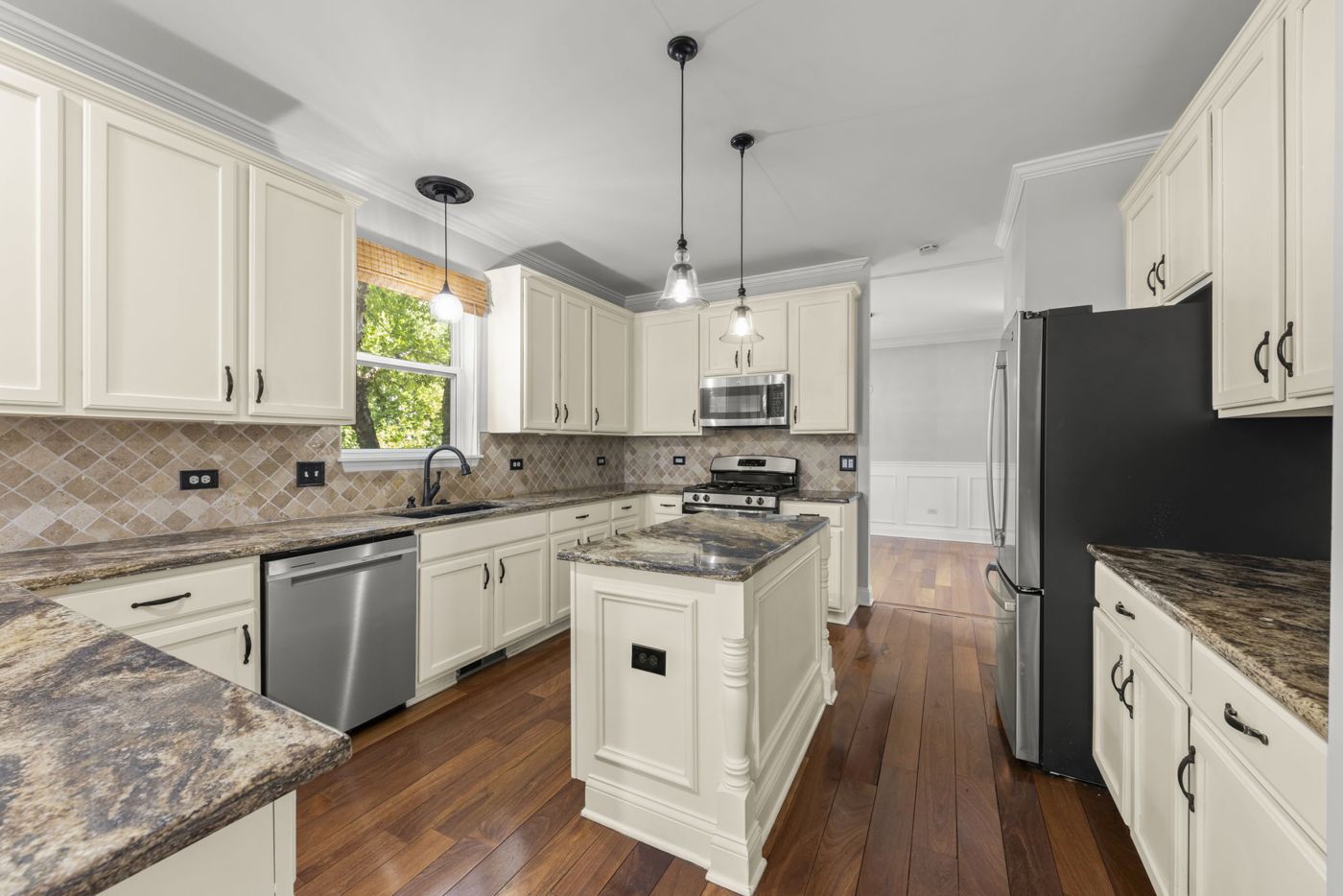 Illinois home kitchen with white cabinets and island